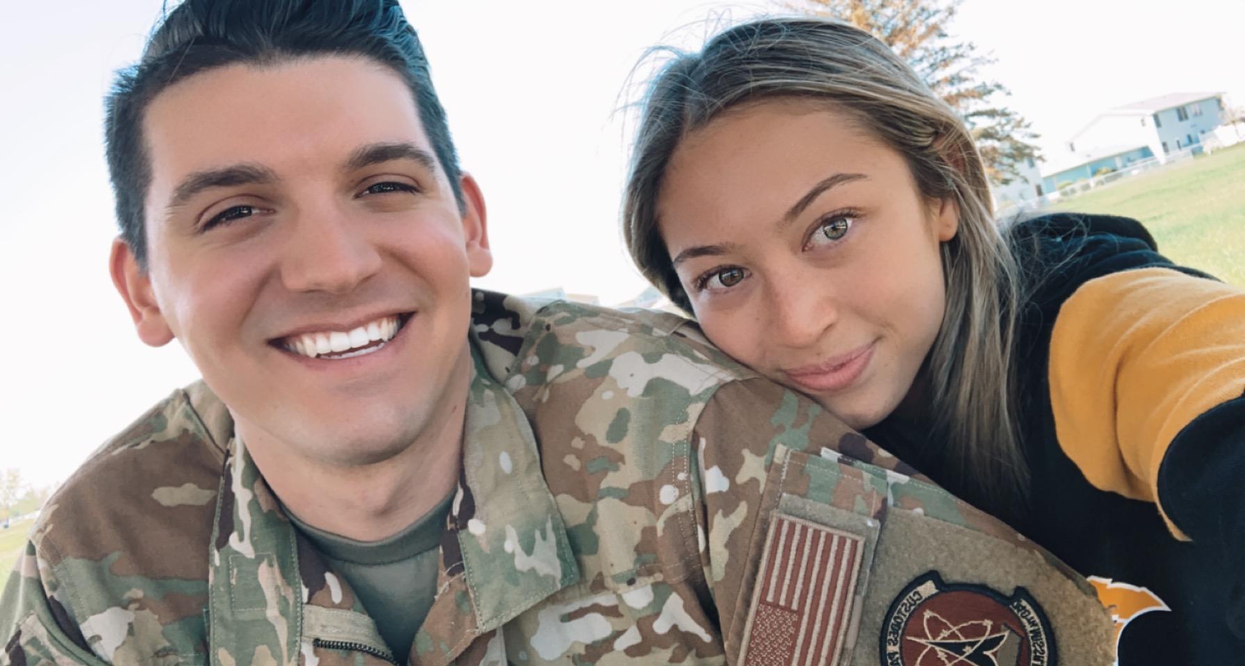 Smiling couple serving heroes in real estate, with boyfriend in United States Air Force uniform